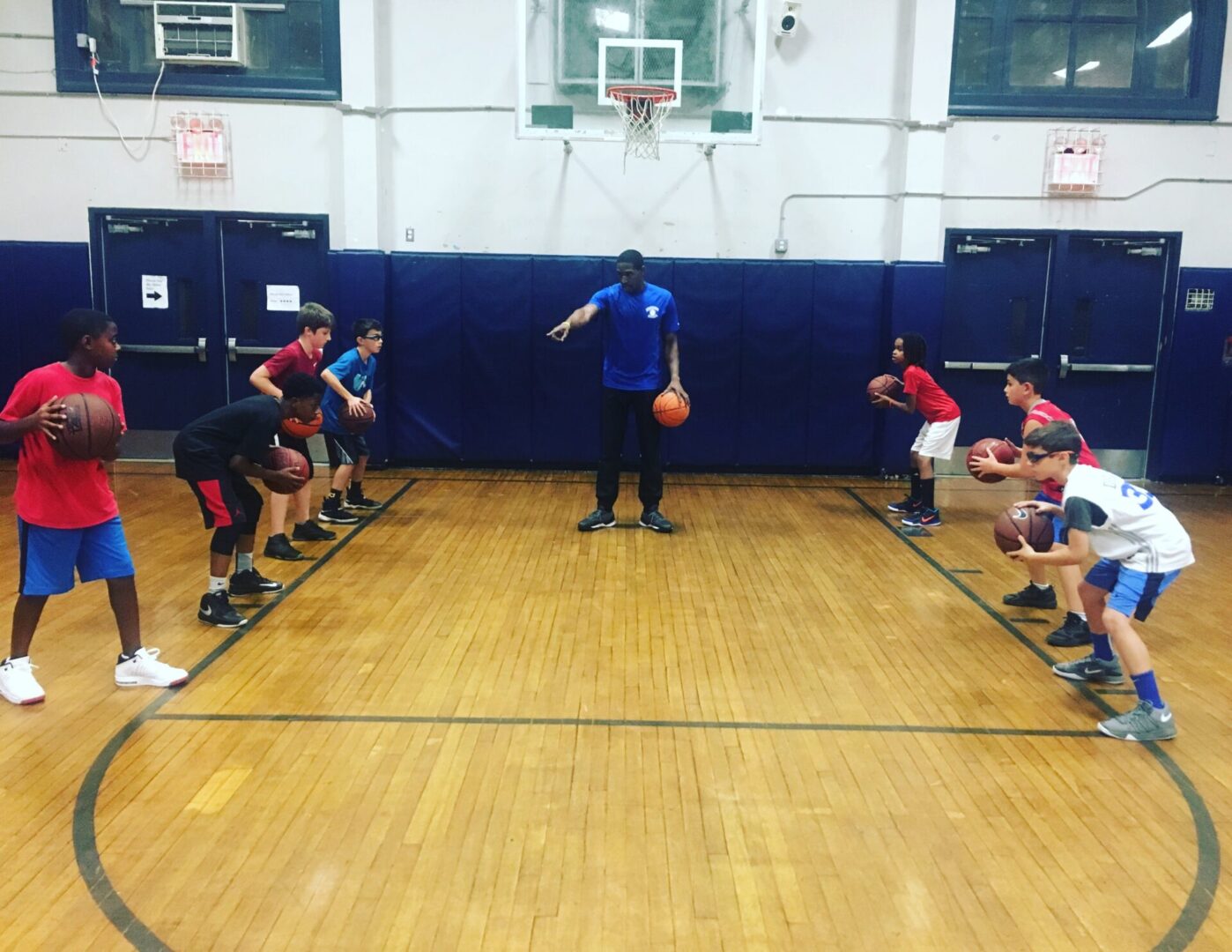 basketball coach is training kids