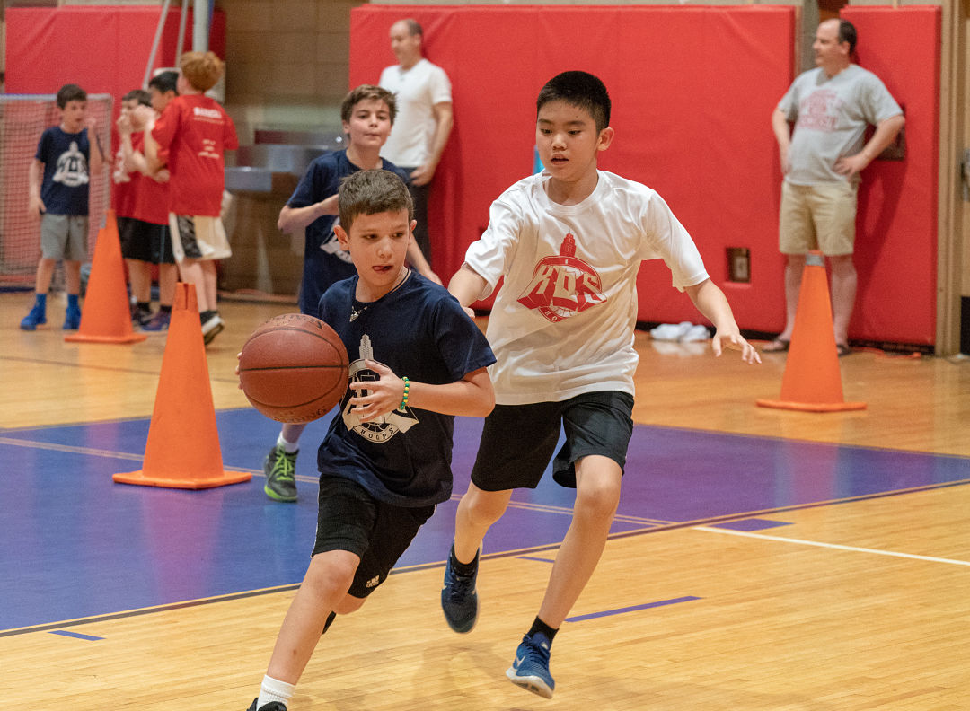 Kids playing basketball at basketball club