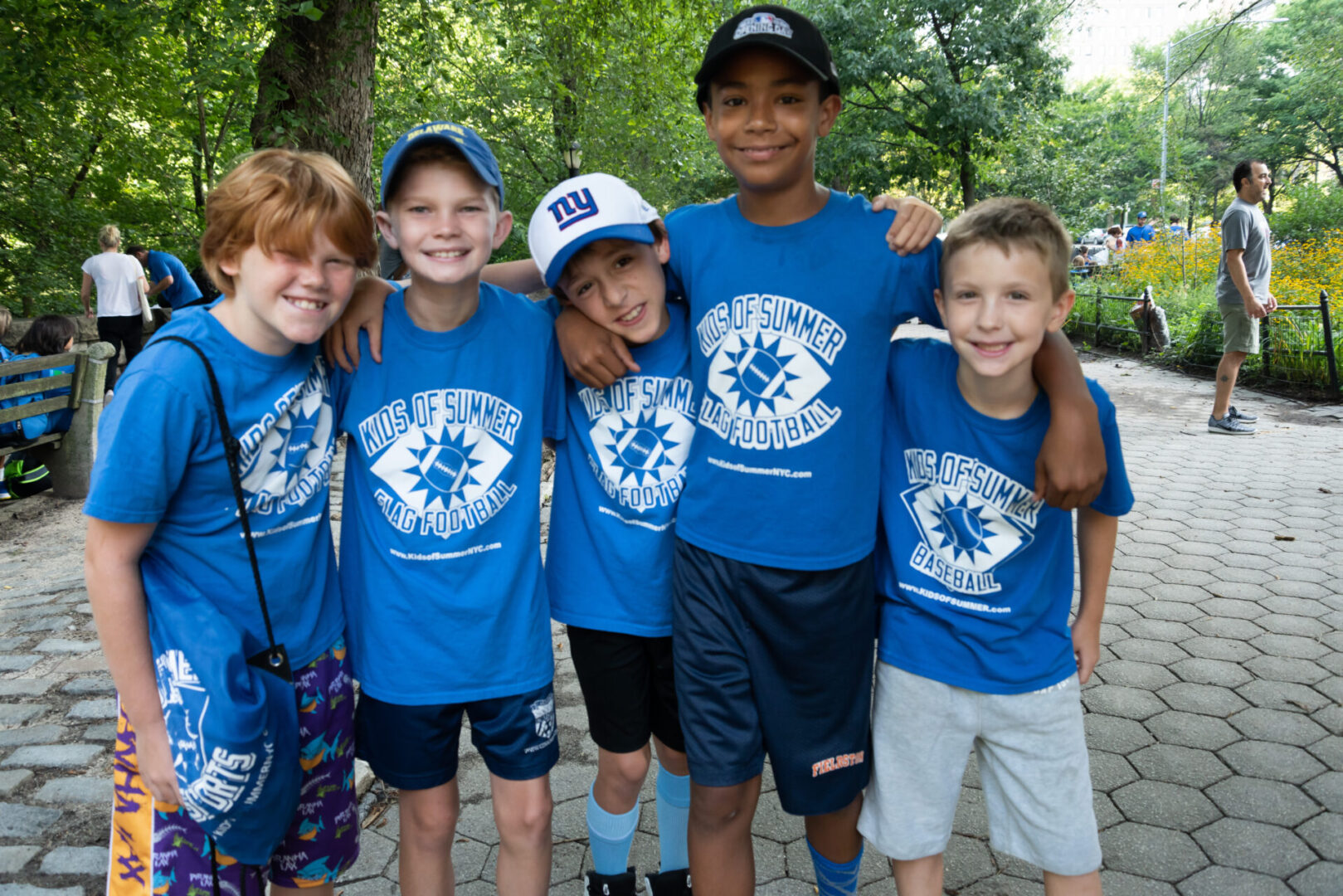 a group of kids wearing Kids of Summer Sports NYC T-shirt